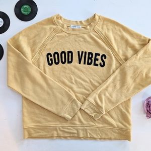 GOOD VIBES: yellow cropped sweater in size M